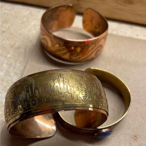 3 - Copper, copper and brass, and copper and brass with a lapis stone, bracelets